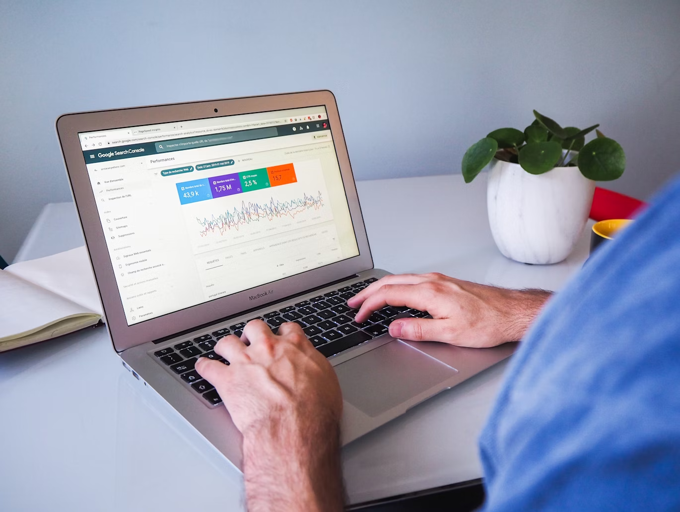a person checking a performance report of the website on a laptop 