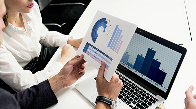 two people checking graphs