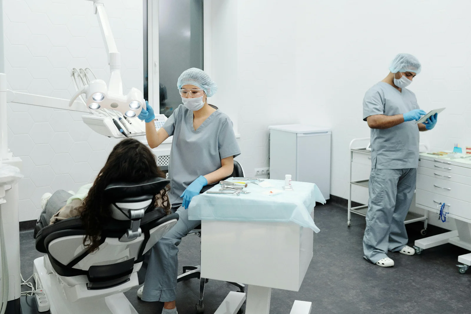 Two dentists working in a dental office