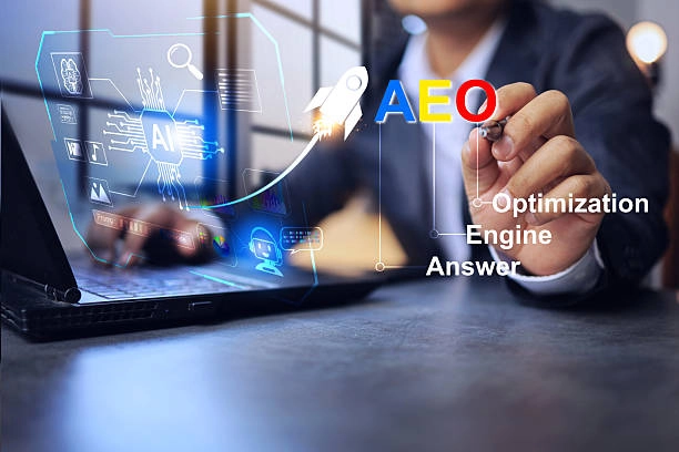 Person using a laptop with AI interface and ‘AEO