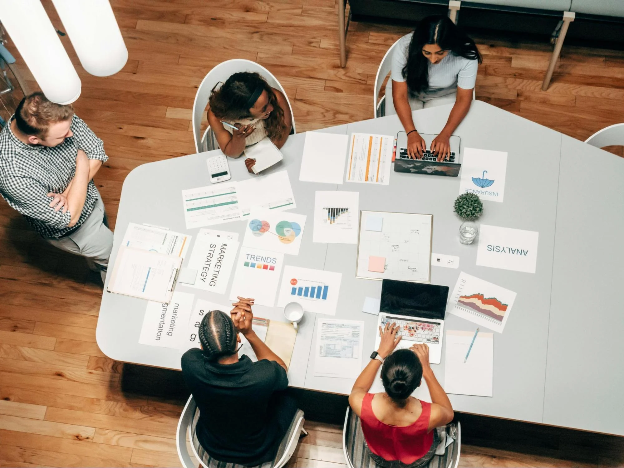Marketing team meeting around conference table