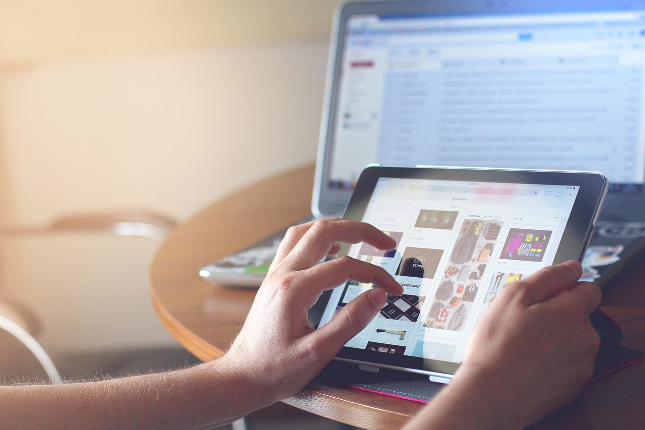 Person reviewing digital designs on a tablet